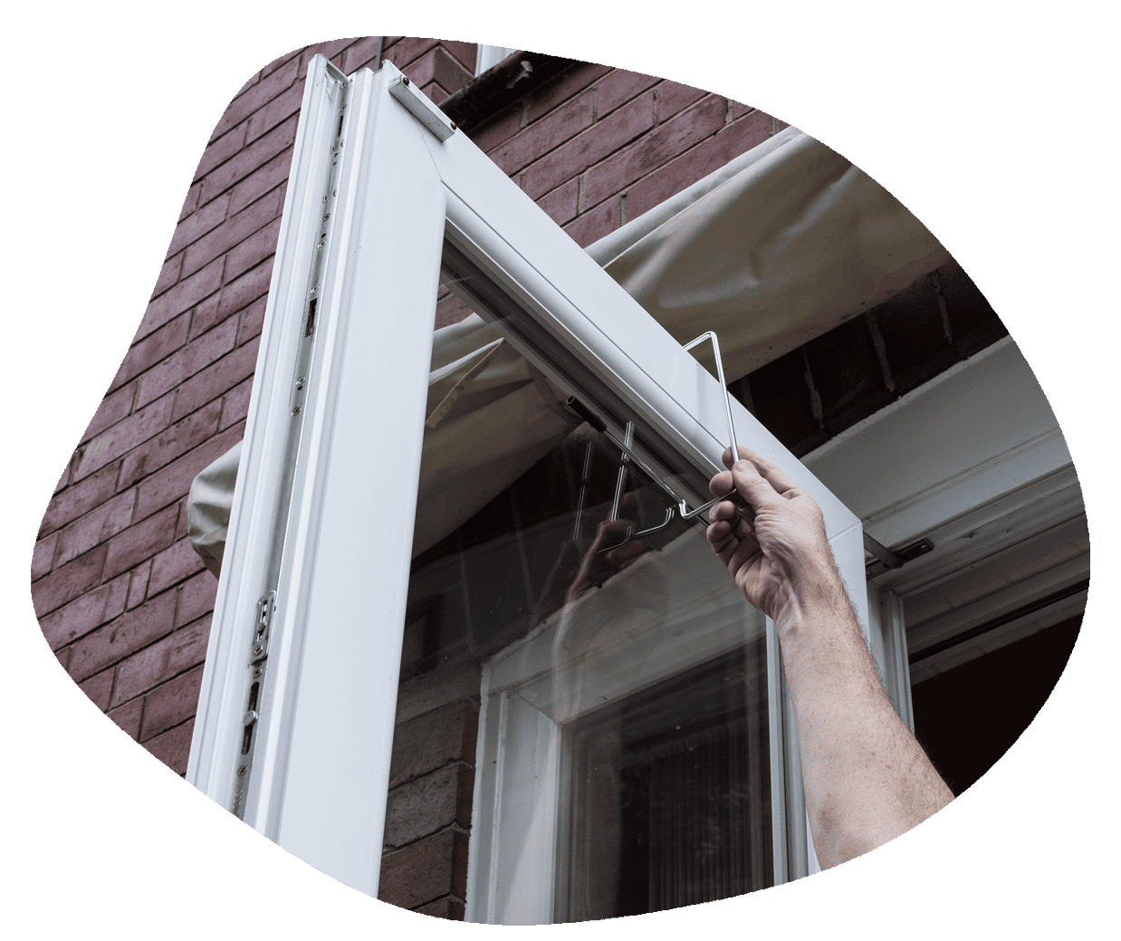 PatioSafe Being Placed In the Rail on Top of the Patio door PatioSafe Being Placed In the Rail on Top of the Patio door